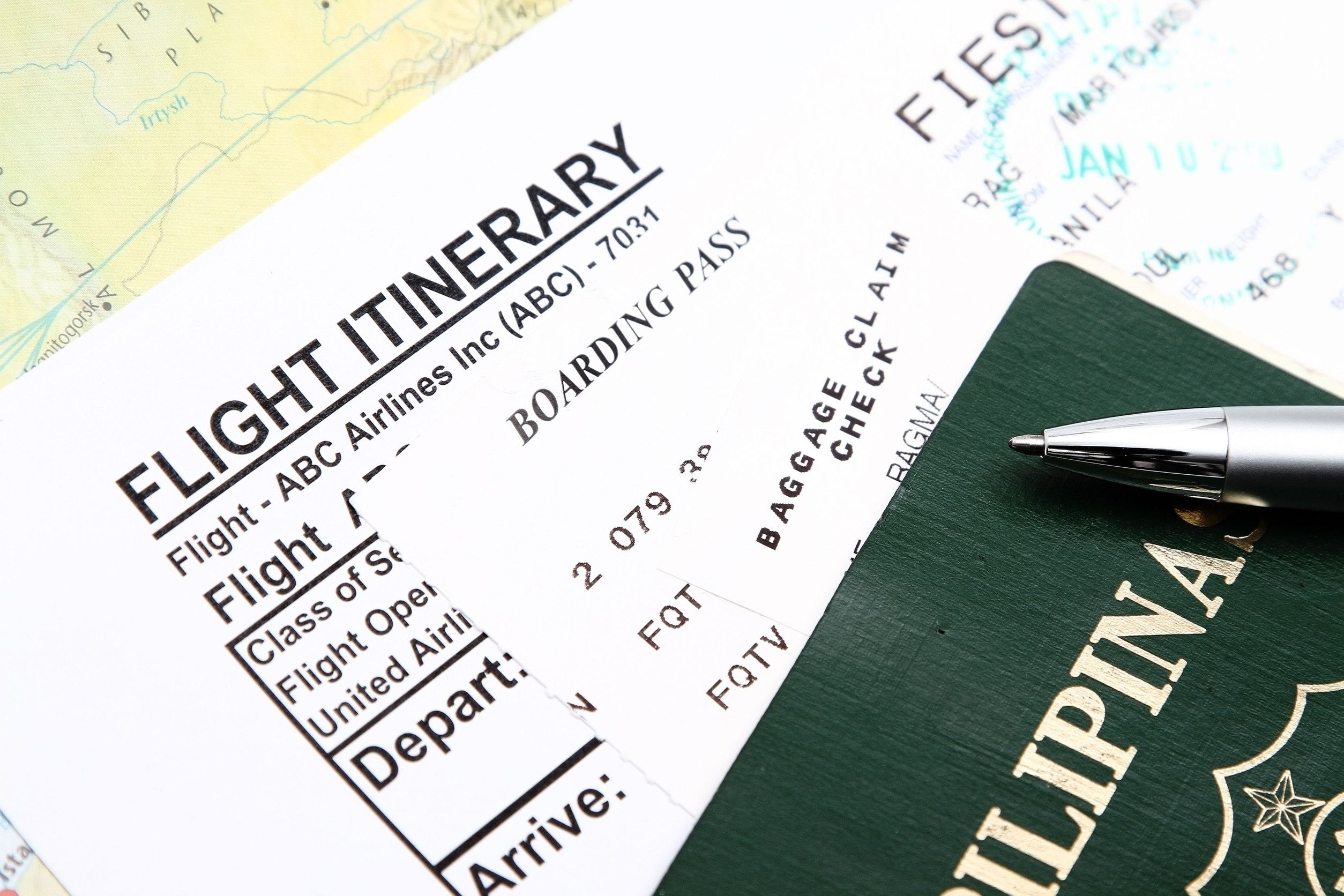 Passport and boarding pass with itinerary ticket