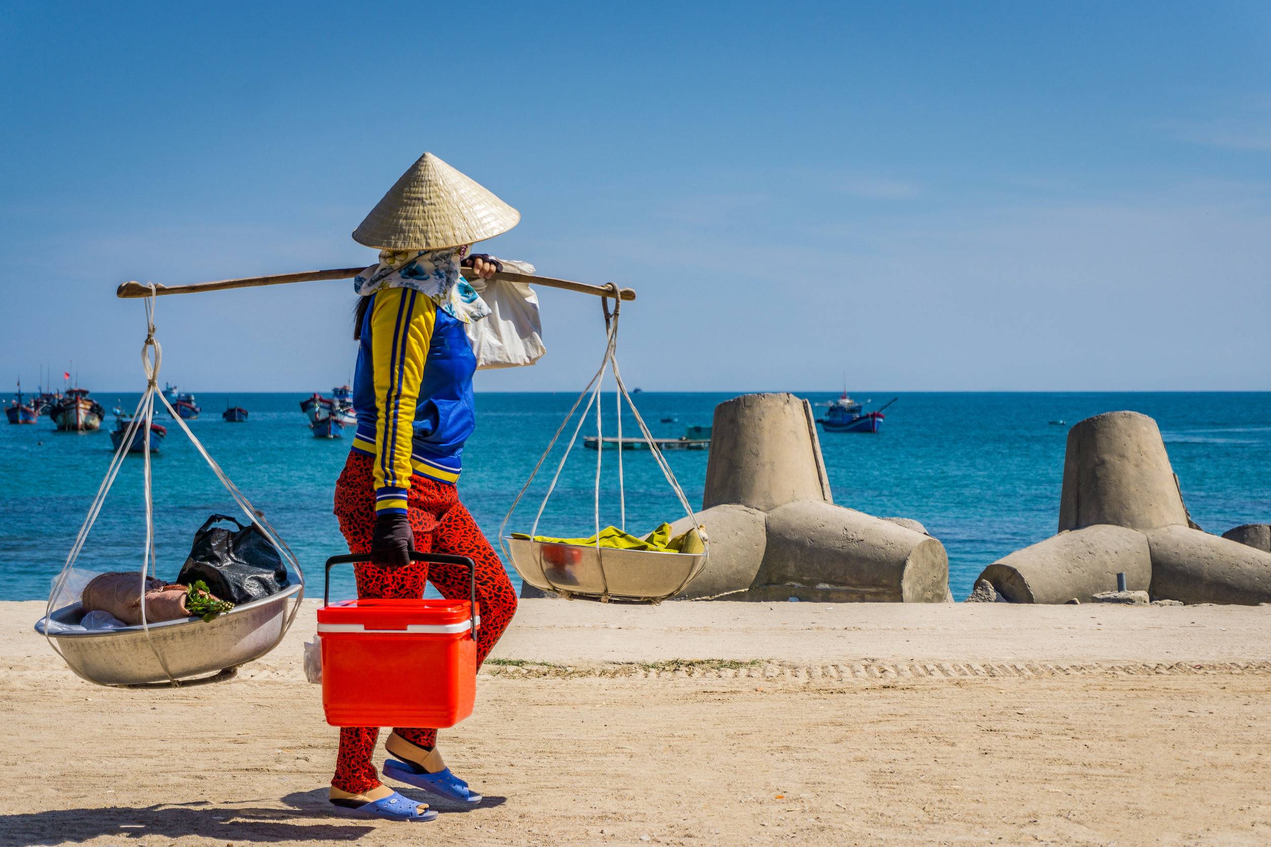 Woman brings basket in beach